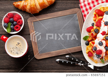 Delicious belgian waffles with summer berries 65697151