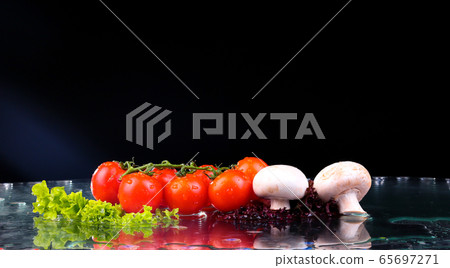 Red tomato cherry, mushrooms and green fresh salad 65697271