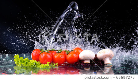Red tomato cherry, mushrooms and green fresh salad 65697273