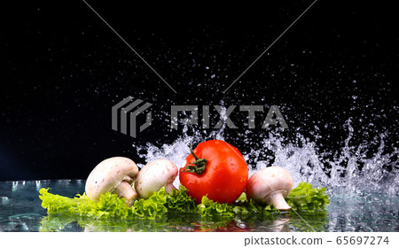 Red tomato cherry, mushrooms and green fresh salad 65697274