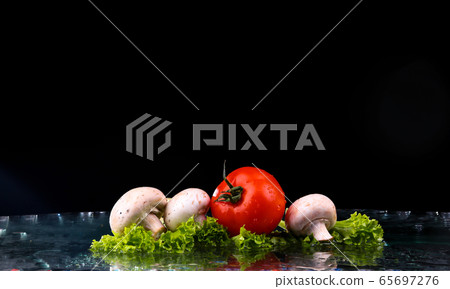 Red tomato cherry, mushrooms and green fresh salad 65697276