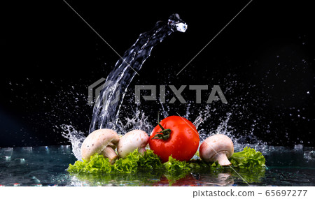 Red tomato cherry, mushrooms and green fresh salad 65697277