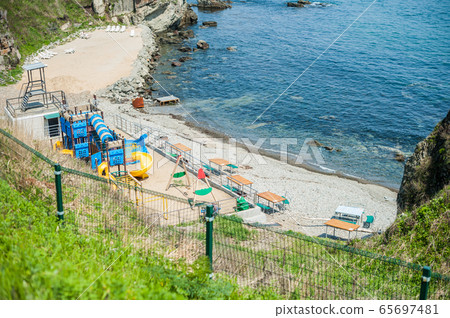 a children's playground on the beach a children's playground on the beach 65697481