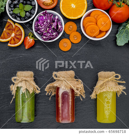 Colourful healthy smoothies and juices in bottles Colourful healthy smoothies and juices in bottles 65698718