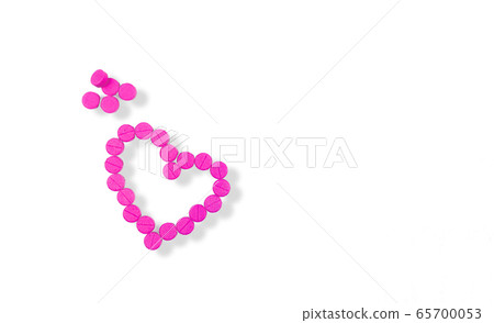 Pink tablets are arranged in a heart shape 65700053
