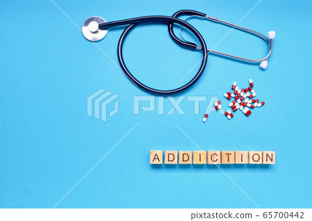 word addiction in woods next to lozenges and word addiction in woods next to lozenges and 65700442