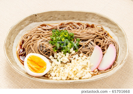 Bukkake soba (chilled). The ingredients are boiled eggs, kamaboko, tempura and green onions. Bukkake soba (chilled). The ingredients are boiled eggs, kamaboko, tempura and green onions. 65701668