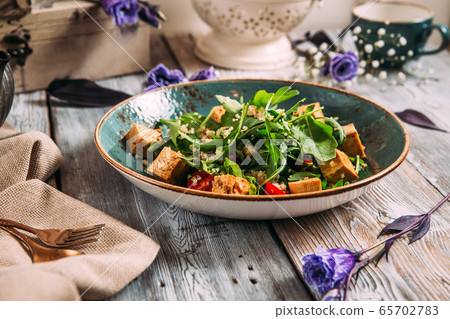 Healthy appetizing tofu salad with vegetables 65702783