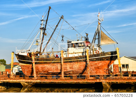 Fishing boat in a shipyard in Buesum on the North Sea in Germany 65703228