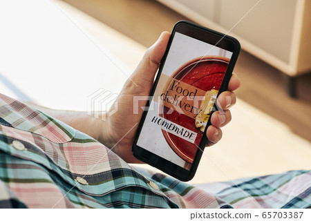 text food delivery homemade in a smartphone text food delivery homemade in a smartphone 65703387
