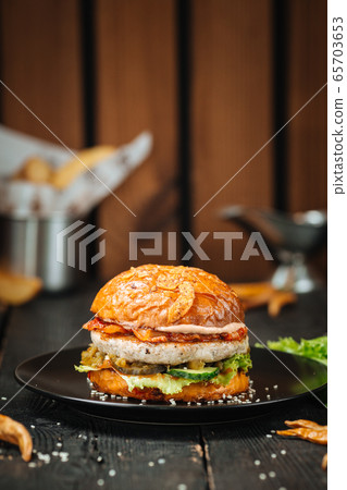 Delicious burger with cutlet and many tasty layers Delicious burger with cutlet and many tasty layers 65703653