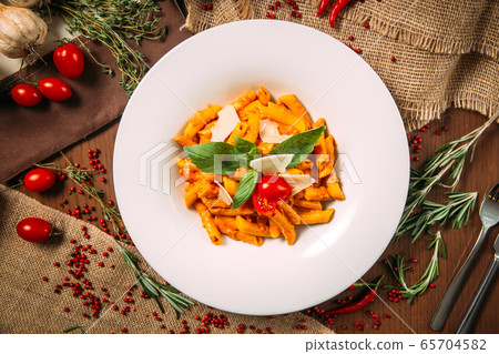 Italian pomadoro penne parmesan cheese and basil Italian pomadoro penne parmesan cheese and basil 65704582