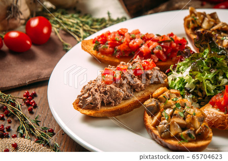 Appetizing italian appetizers bruschettas Appetizing italian appetizers bruschettas 65704623