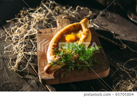 Caucasian cuisine dish khachapuri adjara egg Caucasian cuisine dish khachapuri adjara egg 65705804