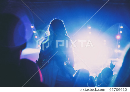 Silhouette of a girl sitting on her father's 65706610