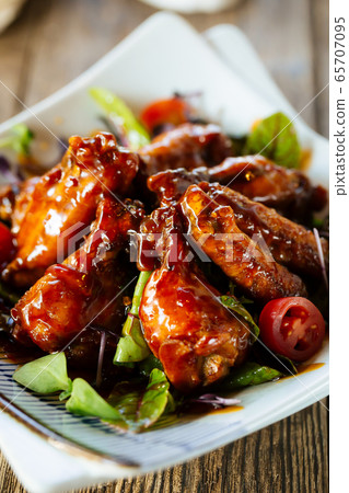 Appetizing snack chicken wings in buffalo sauce 65707095