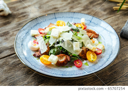 Gourmet appetizing caesar salad with fried chicken 65707254