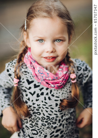 Portrait of beautiful girl in village smiles Portrait of beautiful girl in village smiles 65707347