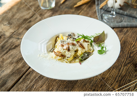 Italian pasta tagliatelle alfredo with mushrooms Italian pasta tagliatelle alfredo with mushrooms 65707758
