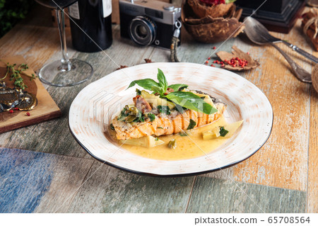 Grilled salmon fillet with sauce balsamic leaves Grilled salmon fillet with sauce balsamic leaves 65708564