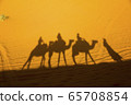 A caravan of camels. Desert in Morocco. 65708854