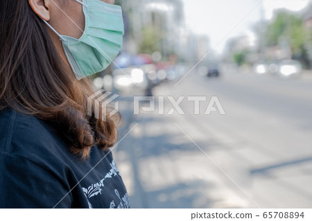 The women wearing the mask, Make a symbol fight in disaster covid19 The women wearing the mask, Make a symbol fight in disaster covid19 65708894