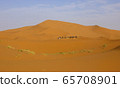 A caravan of camels. Desert in Morocco. 65708901