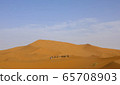 A caravan of camels. Desert in Morocco. 65708903