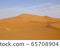 A caravan of camels. Desert in Morocco. 65708904