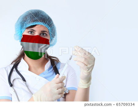 Scientist woman and mask with Hungary flag. 65709334