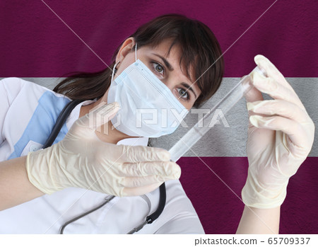 Scientist woman with test tube Coronavirus  65709337
