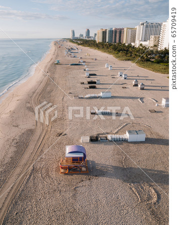 Sandy beach with sun loungers, Miami Beach, Florida, USA Sandy beach with sun loungers, Miami Beach, Florida, USA 65709419