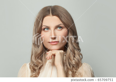 Nice woman with natural skin and healthy hair Nice woman with natural skin and healthy hair 65709751