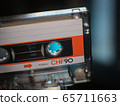 compact white orange cassette closeup. 65711663