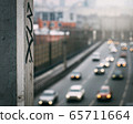 urban graffiti on the background of blurred car traffic in the background 65711664