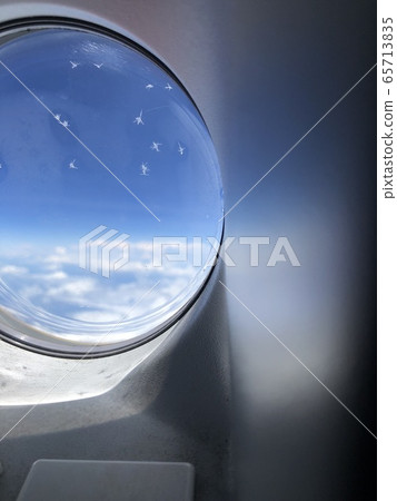 Crystal of ice on the window of the plane Crystal of ice on the window of the plane 65713835