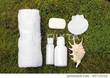 Skin care products on moss Skin care products on moss 65714319