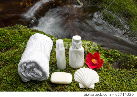 Skin care products on moss with a back of a swamp Skin care products on moss with a back of a swamp 65714320