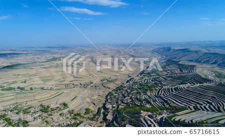 Aerial view of terraced farm field mass production during summer dry season Aerial view of terraced farm field mass production during summer dry season 65716615