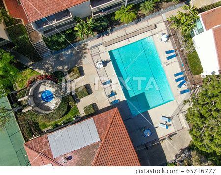 Aerial top view of typical south california community condo with swimming pool 65716777