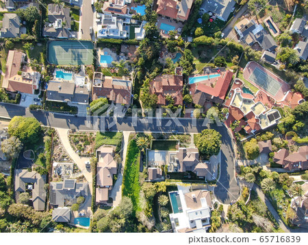 Aerial view of La Jolla little coastline city with wealthy villas and swimming pool.  65716839