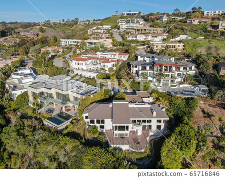 Aerial view of La Jolla little coastline city with wealthy villas and swimming pool.  65716846