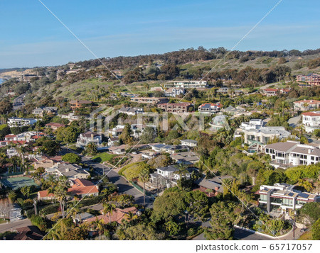 Aerial view of La Jolla little coastline city with wealthy villas and swimming pool. Aerial view of La Jolla little coastline city with wealthy villas and swimming pool. 65717057