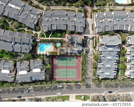 Aerial view of condo community with tennis court and pool in South California Aerial view of condo community with tennis court and pool in South California 65717058