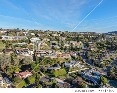 Aerial view of La Jolla little coastline city with wealthy villas and swimming pool. Aerial view of La Jolla little coastline city with wealthy villas and swimming pool. 65717109