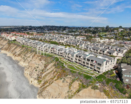 Aerial view of condo community next to the beach and sea in south california Aerial view of condo community next to the beach and sea in south california 65717113