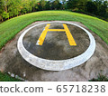 Closeup of helipad for landing helicopters on asphalt ground 65718238