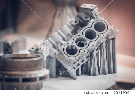 Man is holding object printed on metal 3d printer 65719542