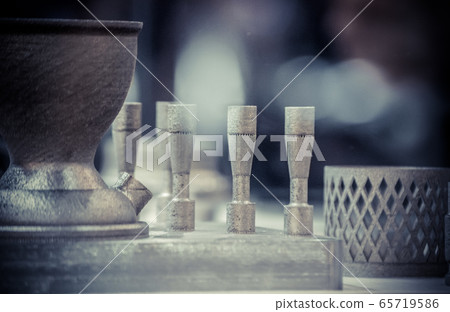 Man is holding object printed on metal 3d printer. Man is holding object printed on metal 3d printer. 65719586
