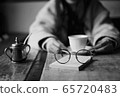 Glasses and coffee shop 65720483